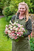 THE REAL FLOWER COMPANY: GIRL HOLDING BEAUTIFUL PINK BOUQUET/POSY WITH ENGLISH SWEET PEAS, ROSES PINK OHARA,WHITE OHARA, CREAM PIAGET,HERITAGE AND PEONY PINK.