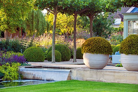 PRIVATE_GARDEN_GLOUCESTERSHIRE_DESIGNED_BY_MARCUS_BARNETT_RILL_WATER_WATERFALL_CONTAINERS_YEW_TERRAC