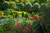 EASTLEACH HOUSE, GLOUCESTERSHIRE: RED BORDER - BOX EDGED BED WITH ALSTROEMERIA, VERBASCUM CHAIXII ALBA, SORBUS ARIA LUTESCENS. FLOWERS, FLOWERING, SUMMER, ENGLISH, GARDEN