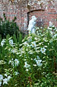 BELMONT HOUSE, SUSSEX - DESIGN ANTHONY PAUL: WALLED GARDEN, STATUE, WHITE PLANTING OF LILIES, LILIUM REGALE, SUMMER, JULY