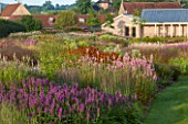 HAUSER & WIRTH, SOMERSET: THE OUDOLF FIELD, DURSLADE FARM - NEW PERENNIAL BORDER BY PIET OUDOLF WITH THE GALLERY BEHIND