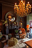 ABIGAIL AHERN HOUSE, LONDON: THE OFFICE / STUDIO. FIREPLACE, CONVEX MIRROR, ROOM PAINTED IN HUDSON BLACK PAINT, LAZZARO CHANDELIER - LIGHTS, LIGHTING