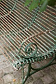 HENRIETTA COURTAULDS HOUSE, NOTTING HILL, LONDON: THE LAND GARDENERS - METAL BENCH IN GARDEN. SEAT, A PLACE TO SIT, RUSTY, PATIO, TERRACE