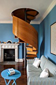 MORTON HALL, WORCESTERSHIRE: STUDY. PAINTED FB COOKS BLUE.19TH CENTURY FIREPLACE.SOFABED JAMES BY MILANO.SPIRAL STAIRCASE IN BRUSHED STEEL & SMOKED OAK BY CARL GEORG LUETCKE