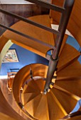 MORTON HALL, WORCESTERSHIRE: DETAIL OF SPIRAL STAIRCASE IN BRUSHED STEEL AND SMOKED OAK, DESIGNED BY CARL GEORG LUETCKE. LOOKING DOWN FROM BEDROOM INTO STUDY