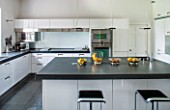 MORTON HALL, WORCESTERSHIRE: KITCHEN BY ARCLINEA DESIGNED BY CITTERIO. SOLID ACRYLIC SURFACES, WORKTOPS IN BRAZILIAN SLATE. APPLIANCES BY GAGGENAU