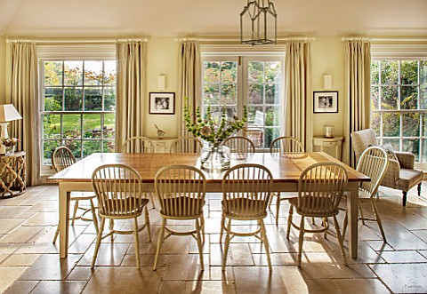 THE_COACH_HOUSESURREYBREAKFAST_ROOM_WITH_LARGE_TABLE__CHAIRS_MANDARIN_STONE_FLOOR_FLOOR_TO_CEILING_S