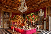 VAUX LE VICOMTE, FRANCE: THE HERCULES ANTECHAMBER AT CHRISTMAS. CEILINGS AND WALL PANELS DECORATED BY LE BRUN IN THE THEME OF HERCULES. DECORATIONS ARE SCENES FROM PETER PAN