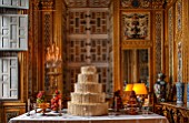 VAUX LE VICOMTE, FRANCE: THE GAMES PARLOUR DECORATED FOR CHRISTMAS. THE CENTRAL TABLE IS SET WITH A MAGNIFICENT TIERED CAKE, BRANDY SNAP BOWLS, MACAROONS, CREAM HORNS AND FRUITS