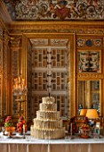 VAUX LE VICOMTE, FRANCE: THE GAMES PARLOUR DECORATED FOR CHRISTMAS. THE CENTRAL TABLE IS SET WITH A MAGNIFICENT TIERED CAKE, BRANDY SNAP BOWLS, MACAROONS, CREAM HORNS AND FRUITS
