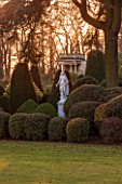 BRODSWORTH HALL, YORKSHIRE: DAWN. WINTER, JANUARY, TOPIARY EVERGREEN, BORDER, FORMAL, GARDEN, COUNTRY, CLIPPED, HEDGE, HEDGES, HEDGING, STATUE, ITALIANATE SUMMERHOUSE