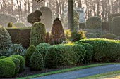 BRODSWORTH HALL, YORKSHIRE: DAWN. WINTER, JANUARY, TOPIARY EVERGREEN, BORDER, FORMAL, GARDEN, COUNTRY, CLIPPED, HEDGE, HEDGES, HEDGING, ITALIANATE SUMMERHOUSE