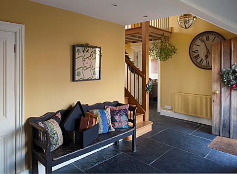 THE_FREETH_HEREFORDSHIRE_HALLWAY__SLATE_TILES_SLABS_SWEDISH_WOODEN_BENCH_PRINT_ROOM_YELLOW_FROM_FARR