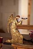 THE FREETH, HEREFORDSHIRE: KITCHEN, DINER - GOLDEN ANGEL CANDLE HOLDERS. CHRISTMAS