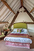 THE FREETH, HEREFORDSHIRE: DOUBLE BEDROOM - BED, HEADBOARD IN GREEN LINEN, WICKER CHAIR