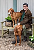 AVONDALE NURSERIES, COVENTRY: BRIAN ELLIS WITH HIS TWO PET VIZSLA DOGS JESS AND LILY AT THE NURSERY