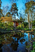 MORTON HALL, WORCESTERSHIRE: THE JAPANESE TEA HOUSE AND BIRCH TREES REFLECTED IN THE WATER OF THE LOWER POND. REFLECTION, REFLECTIONS, TREE, BARK, WHITE, GARDEN, BUILDING, POOL