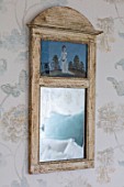 LONDON HOUSE DESIGNED BY JULIE SIMONSEN. ANTIQUE PAINTED MIRROR IN BLUE BEDROOM.