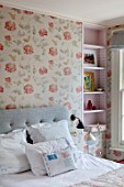 LONDON HOUSE DESIGNED BY JULIE SIMONSEN. PINK BEDROOM SHOWING OSBORNE & LITTLE WALLPAPER, GREY LINEN BEDHEAD AND ZARA HOME BEDLINEN.