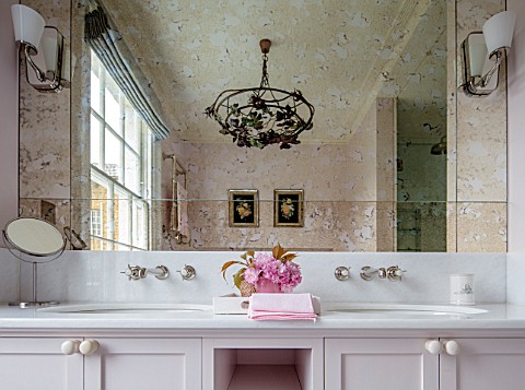LONDON_HOUSE_DESIGNED_BY_JULIE_SIMONSEN_PINK_BATHROOM_WITH_DOUBLE_BASINS_REFLECTION_OF_ANTIQUE_CHAND