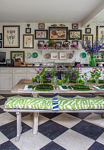 BUTTER_WAKEFIELD_HOUSE_LONDON_THE_KITCHEN__TABLE_SET_WITH_GREEN_PLATES_AND_FLOWERS_FROM_THE_GARDEN_I