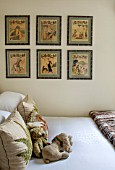 BUTTER WAKEFIELD HOUSE, LONDON. ZOES BEDROOM. NEUTRAL BACKDROP AND BED LINEN WITH VINTAGE WALL PRINTS AND CUSHIONS