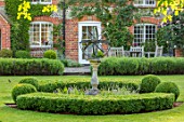 COTTAGE ROW, DORSET: LAWN, SUNDIAL, BOX HEDGE, SPRING, WALL, BUXUS, ORNAMENT, CLASSIC, COUNTRY, GARDEN, HOUSE, SUMMER, FORMAL