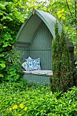 THE LODGE, OXFORDSHIRE: DESIGNER SUSAN ASHTON. THE BOAT SEAT IN A SEA OF GALLIUM ODORATUM - SWEET WOODRUFF. ARBOUR. A PLACE TO SIT. RELAX,COUNTRY GARDEN