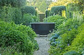 HAZELBY HOUSE, BERKSHIRE: SUMMER, COUNTRY, GARDEN, GREEN, BORDERS, URN, WATER FEATURE, HEDGES, HEDGING