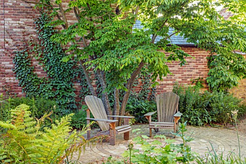THE_OLD_RECTORY_QUINTON_NORTHAMPTONSHIRE_DESIGNER_ANOUSHKA_FEILER_PATIO_WITH_ADIRONDACK_CHAIRS_SEATS
