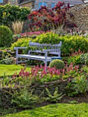 PETTIFERS, OXFORDSHIRE: LAWN, PURPLE, WOODEN, BENCH, SEAT, COTINUS, BORDERS, FALL, AUTUMN, LATE, SUMMER, PATH, ENGLISH, COUNTRY, GARDEN