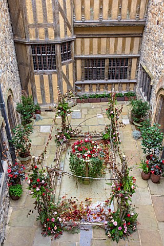 LEEDS_CASTLE_KENT_COURTYARD_WITH_FLOWERS_TWIGS_BRANCHES