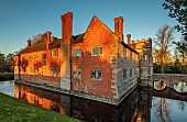 BADDESLEY CLINTON, WARWICKSHIRE: THE NATIONAL TRUST- CHRISTMAS, 15TH AND 16TH CENTURY MOATED MANOR HOUSE. SUNRISE, DECEMBER