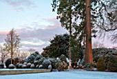 MORTON HALL, WORCESTERSHIRE: WINTER - FROST, SNOW, LAWN, ENGLISH, COUNTRY, GARDEN, COLD, DECEMBER, DAWN, SUNRISE, BOX, TOPIARY, CLIPPED, STATUE, STAUES, HEDGES, HEDGING