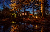 MORTON HALL, WORCESTERSHIRE: NIGHT TIME, LIGHTS, LIGHTING, EVENING, WATER, GARDEN, COUNTRY, HOUSE, TREES, POND, POOL, REFLECTIONS, REFLECTED