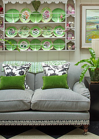 BUTTER_WAKEFIELD_HOUSE_LONDON_THE_CONSERVATORY__GREY_SOFA_CUSHIONS_CHEQUERBOARD_FLOOR_PLATES_WALL_CU