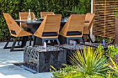 ASCOT SPRING GARDEN SHOW: DESIGNER TOM HILL. COURTYARD, DINING AREA, CANOPY, TABLE, CHAIRS, WATER FEATURE, ENCLOSED, PRIVATE, SCREENS, SCREENING, SCREENED, SMALL, TOWN, URBAN