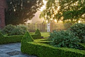 MITTON MANOR, STAFFORDSHIRE: CLIPPED TOPIARY BOX HEDGING, WHITE GATE, MORNING LIGHT, DAWN, SUNRISE, HEDGES, BUXUS
