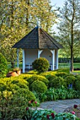 MITTON MANOR, STAFFORDSHIRE: TOPIARY GARDEN, FORMAL, COUNTRY, BOX, TOPIARY, HEDGES, HEDGING, EVERGREEN, SPRING, SUMMERHOUSES