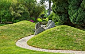 CHILWORTH MANOR, SURREY: GRAVEL PATH THROUGH LAWN AND ROCKS IN JAPANESE GARDEN, HILL
