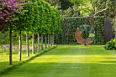 CHILWORTH MANOR, SURREY: LAWN, VIEW TO DAVID HARBER SCULPTURE, SPRING