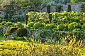 CHILWORTH MANOR, SURREY: THE WALLED GARDEN. STEPS, WALLS, CLIPPED TOPIARY BOX, BUXUS, WHITE WISTERIA
