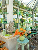 CLAUS DALBY GARDEN, DENMARK: GREENHOUSE, STUDIO - STATUE, EMPTY CONTAINERS FOR FLOWER ARRANGING IN GREEN. TULIPS CAIRO, PEACH BLOSSOM, SENSUAL TOUCH, BROWN SUGAR