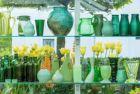 CLAUS_DALBY_GARDEN_DENMARK_GREENHOUSE_STUDIO__GREEN_CONTAINERS_FOR_FLOWER_ARRANGING_ON_SHELVES