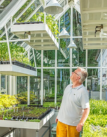 CLAUS_DALBY_GARDEN_DENMARK_CLAUS_DALBY_IN_ONE_OF_HIS_GREENHOUSES_FILLED_WITH_SEEDLINGS