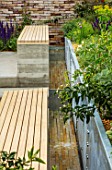 CHELSEA FLOWER SHOW 2018: THE LEMON TREE TRUST - DESIGNER TOM MASSEY: WOODEN BENCHES, SEATS AND WATER RILL, RILLS, RUNNING, SPOUT