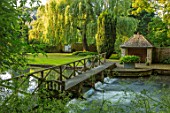 ABLINGTON MANOR, GLOUCESTERSHIRE: WOODEN BRIDGE OVER COLN RIVER IN SUMMER, SUMMERHOUSE, SUMMER HOUSE, BUILDING, WATER