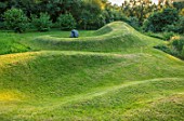 ASTHALL MANOR, OXFORDSHIRE: TURF MOUNDS, SUNSET, LAWN, HILL, HILLS, VIEWING MOUND, GREEN, GRASS