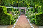 WORMSLEY, BUCKINGHAMSHIRE: FLINT AND BRICK PATH THROUGH THE WALLED GARDEN - BORDER WITH PERENNIALS, SUMMER, ENGLISH, COUNTRY, GARDEN, WALLS, WALLED, YEW HEDGES, HEDGING