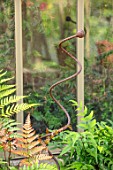 THE WALLED GARDEN AT COWDRAY, WEST SUSSEX: ENGLISH, COUNTRY, GARDEN, METAL SCULPTURE IN CONTAINER IN GLASSHOUSE, GREENHOUSE